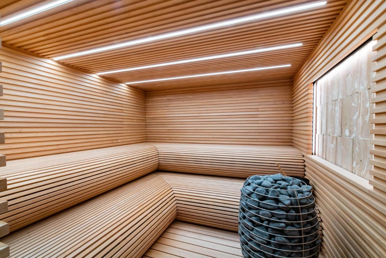 Wide custom indoor sauna in cedar
